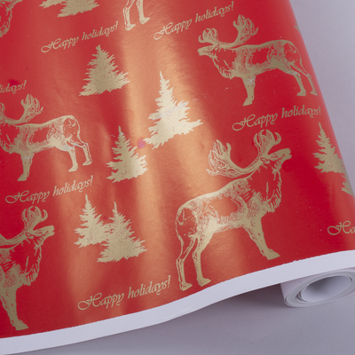 Папір подарунковий новорічний "Золотий лось на червоному" 70см * 10м 3832-157 фото